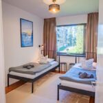Third bedroom with two single beds at Nine Pines