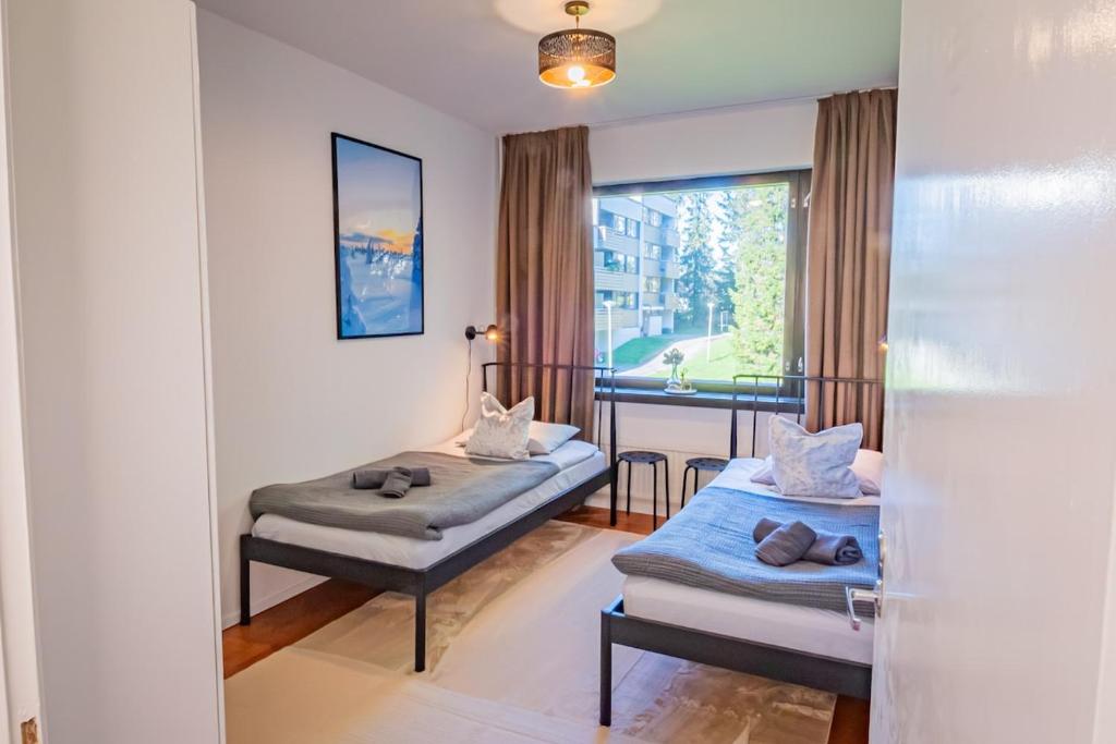 Third bedroom with two single beds at Nine Pines